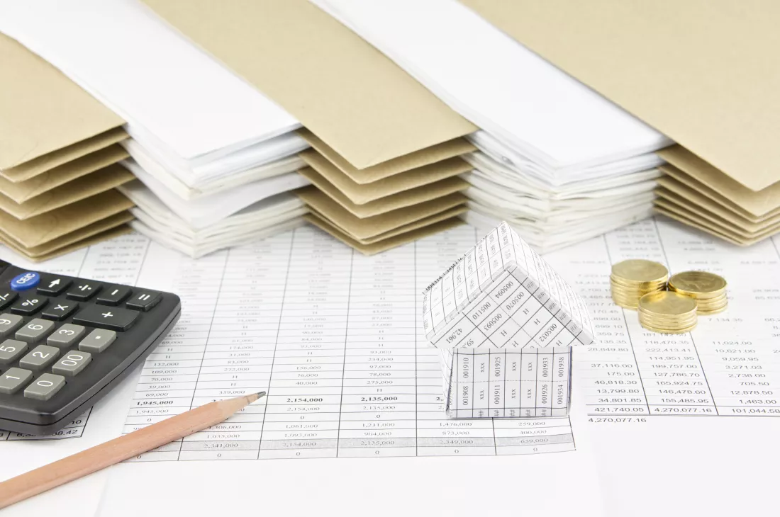 close-up-calculator-coins-documents